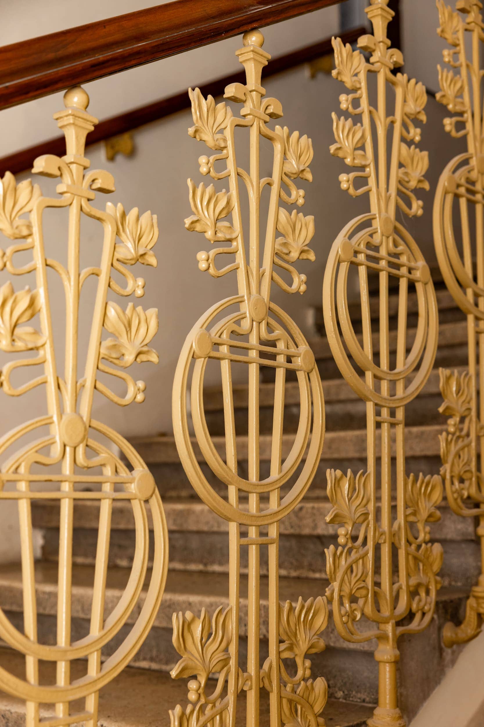 building facade, white, with green ivy climbing up
